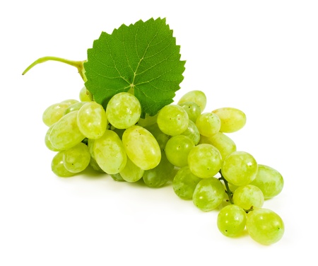 Green grapes with leaves isolated on whiteの写真素材