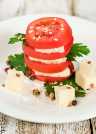 dish of tomato, feta and parsley close-upの写真素材
