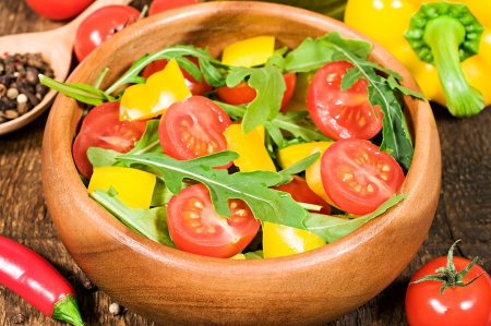 salad with cherry tomatoes , sweet peppers and rugula の写真素材