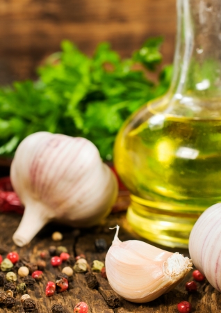 garlic, vegetable oil, spices and kitchen herbs close-upの写真素材