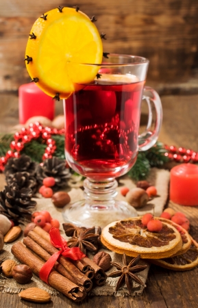 Christmas still life with mulled wine , fir-tree and spicesの写真素材