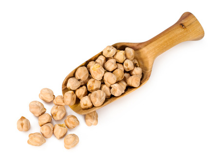chick peas in a wooden scoop isolated on whiteの写真素材