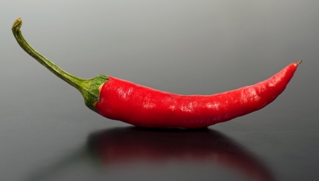 red hot peppers close-up on dark backgroundの写真素材