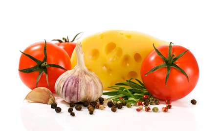 cheese with tomatoes and spices isolated on whiteの写真素材