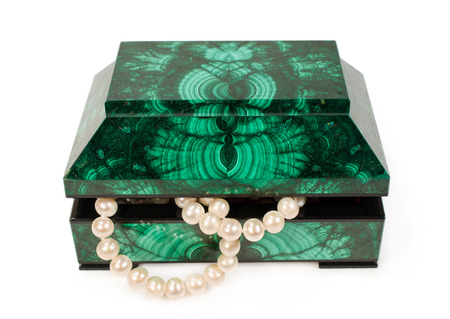 Malachite  treasure-box with a pearl necklace isolated on whiteの写真素材