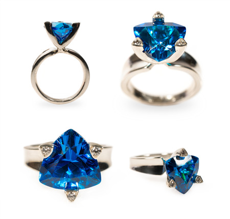 platinum ring with a sapphire in different angles isolated on whiteの写真素材