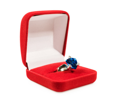 platinum ring with topaz in a box isolated on whiteの写真素材