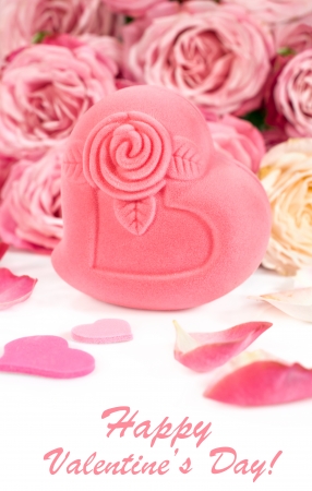 Valentines Day. Gift box in heart shape with roses and petalsの写真素材