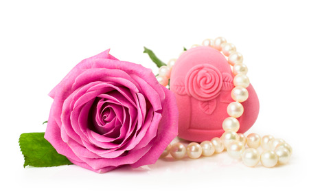 Rose with gift box and a string of pearls isolated on whiteの写真素材