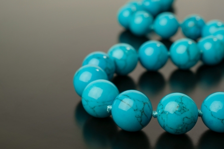 turquoise necklace isolated on blackの写真素材