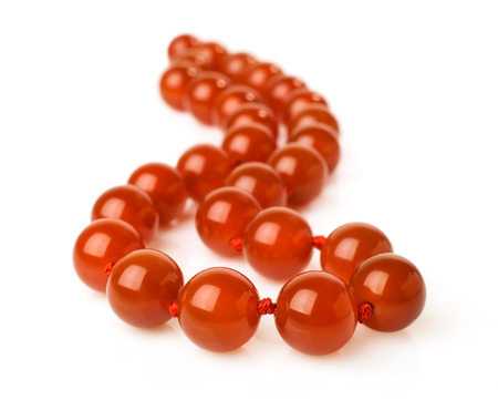 Carnelian necklace isolated on whiteの写真素材