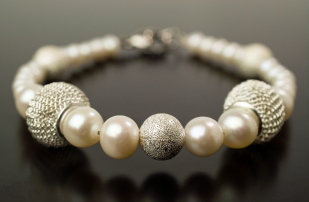 Pearl bracelet isolated on black の写真素材