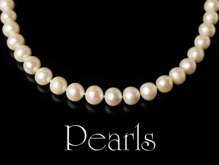 Necklace of white pearls isolated on blackの写真素材