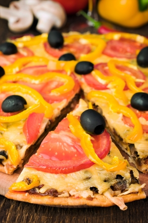 Vegetarian pizza with tomatoes and olives close-upの写真素材