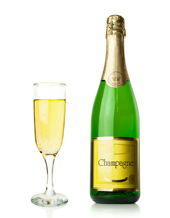 bottle and glass of champagne  isolated on whiteの写真素材