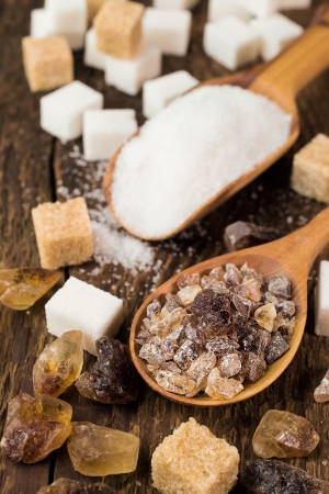 Sugar cane , brown and white cubes on woodenの写真素材