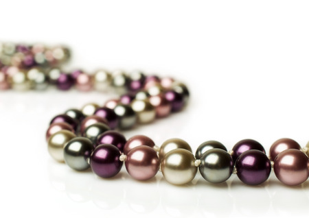 color pearl necklace isolated on whiteの写真素材