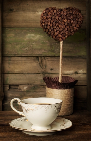 cup of coffee with a decorative topiaryの写真素材