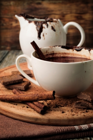 Hot chocolate with cinnamon on woodenの写真素材