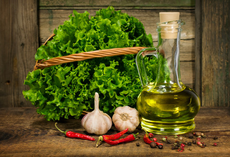 Raw ingredients for cooking in rustic setting on woodenの写真素材