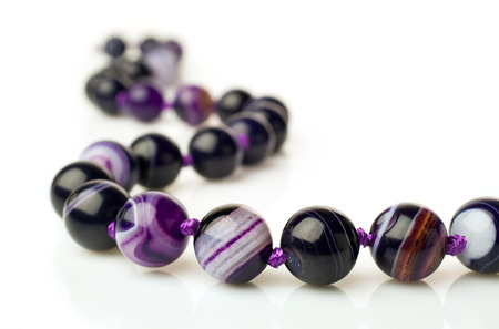 purple agate necklace isolated on whiteの写真素材