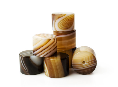 agate beads with different textures isolated on whiteの写真素材