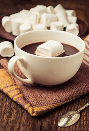 hot chocolate with marshmallows on a wooden backgroundの写真素材
