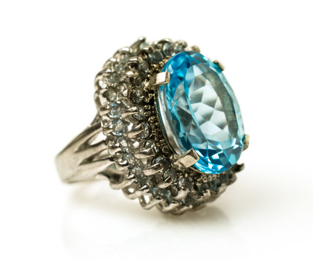 silver ring with big natural topaz isolated on whiteの写真素材