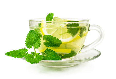 lemon ice-tea in a glass cup isolated on whiteの写真素材