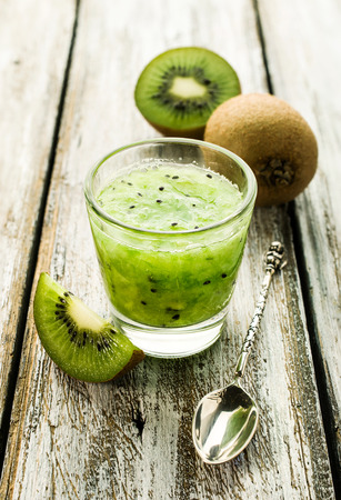 Smoothies of kiwi on the wooden tableの写真素材