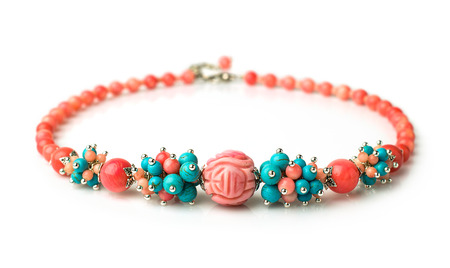 lovely necklace of coral and turquoise isolated on whiteの写真素材