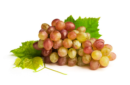 ripe pink grapes isolated on whiteの写真素材