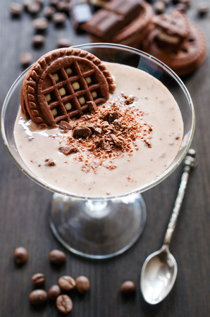 chocolate mousse with cocoa cookies on black woodenの写真素材
