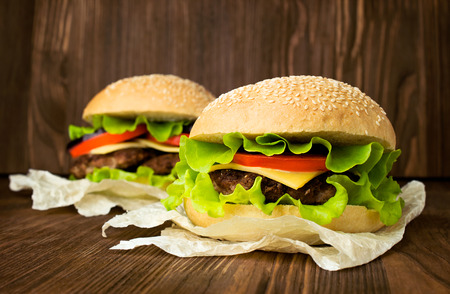 Two big hamburger on woodenの写真素材