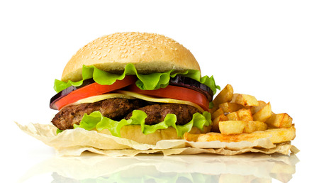 delicious cheeseburger with french fries isolated on whiteの写真素材