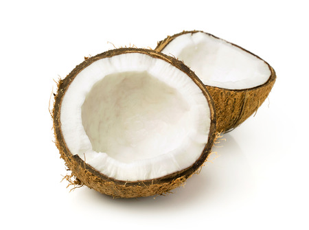 Two halves of coconut isolated on whiteの写真素材