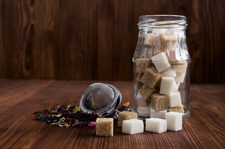 Brown and white sugar cubes on woodenの写真素材
