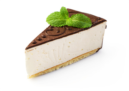 Piece of cheesecake with chocolate isolated over whiteの写真素材