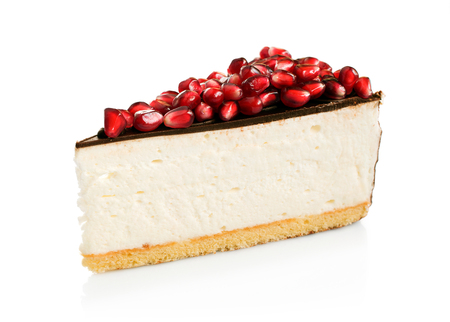 Cheesecake with chocolate and pomegranate isolated over whiteの写真素材