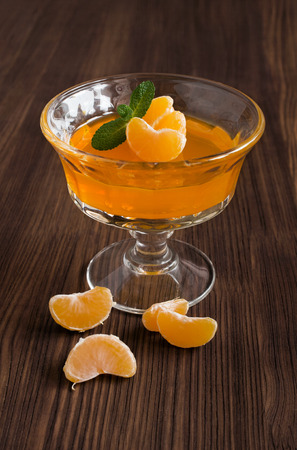 Tangerine jelly on a wooden backgroundの写真素材