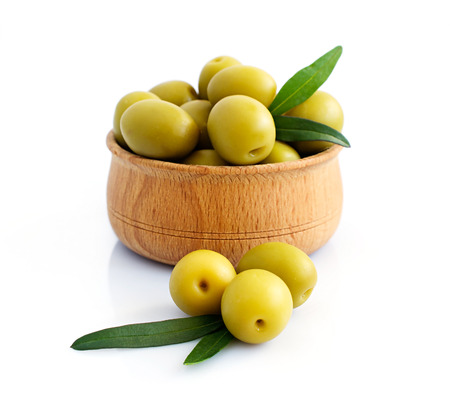 Bowl of brine cured green olives isolated over whiteの写真素材