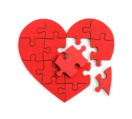 Puzzle of the heart shape isolated on the whiteの写真素材