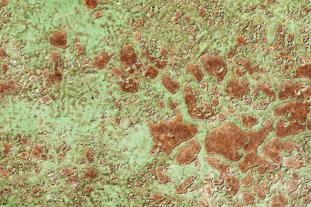 Abstract background with old cracked paint on a rusty metal textureの写真素材