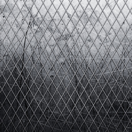Old metal gate covered with geometric patternの写真素材
