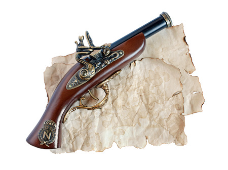 Beautiful old musket or pistol and paper isolated on white backgroundの写真素材