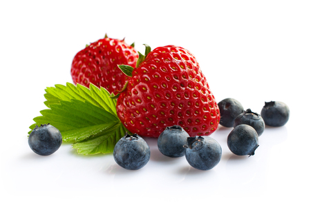 Strawberry and blueberry isolated on whiteの写真素材