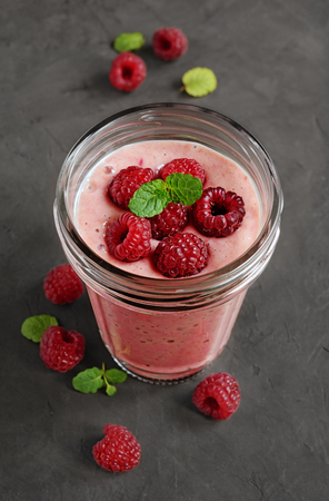 Delicious raspberry mousse with fresh raspberries in glassの写真素材