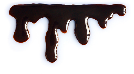 Melted chocolate dripping on white background, close upの写真素材