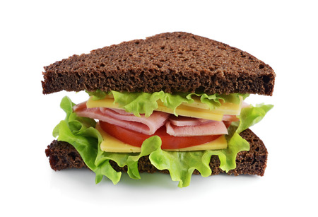 Sandwich with rye bread, ham, tomato, cheese and lettuce isolated on white backgroundの写真素材