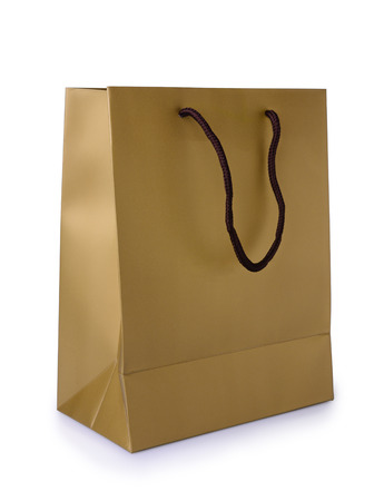 Golden gift bag isolated on white backgroundの写真素材